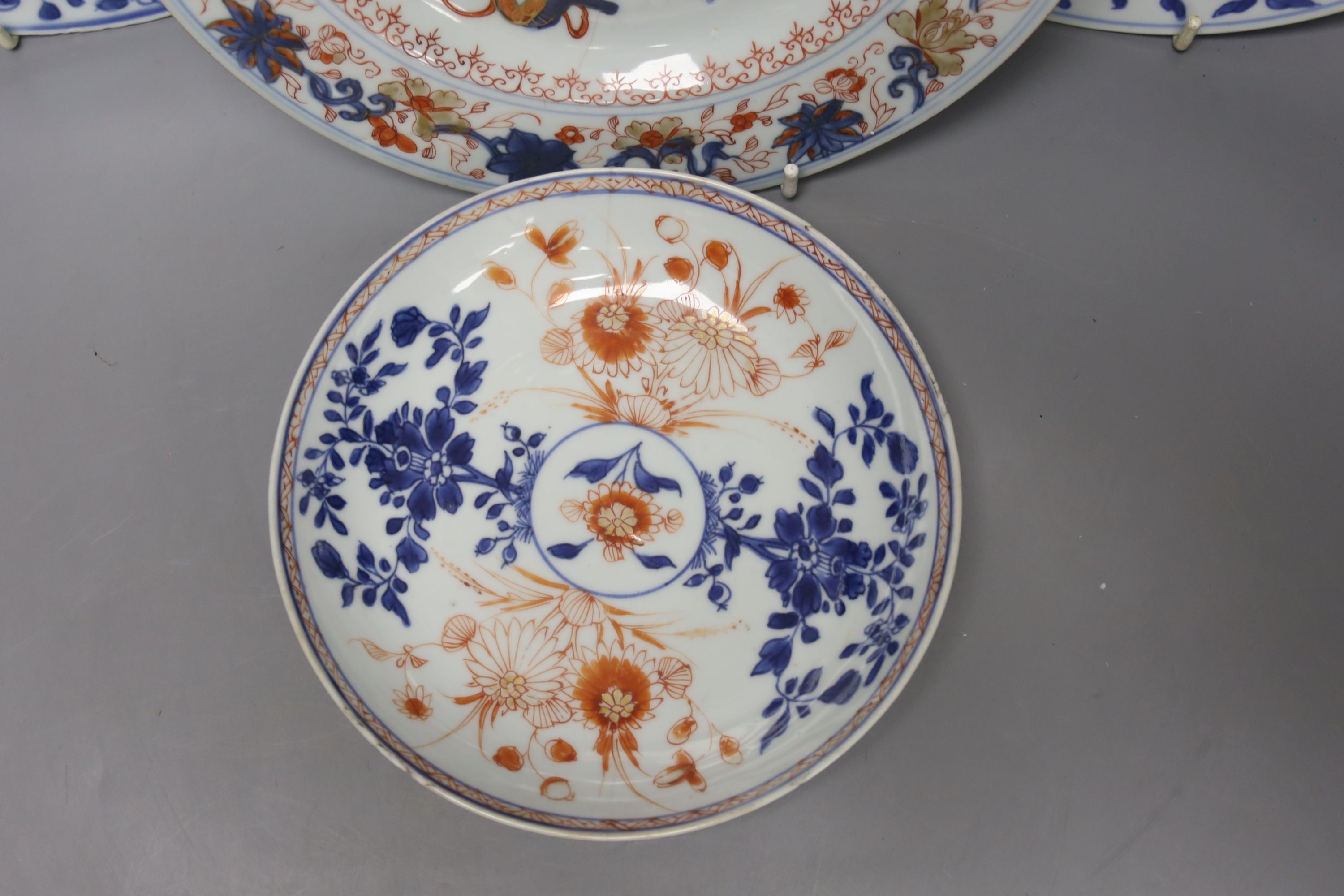 A pair of 18th century Chinese blue and white plates, together with two Chinese Imari dishes, all Kangxi period, largest 23cm